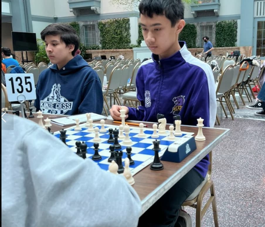 Students engaged in strategic chess learning