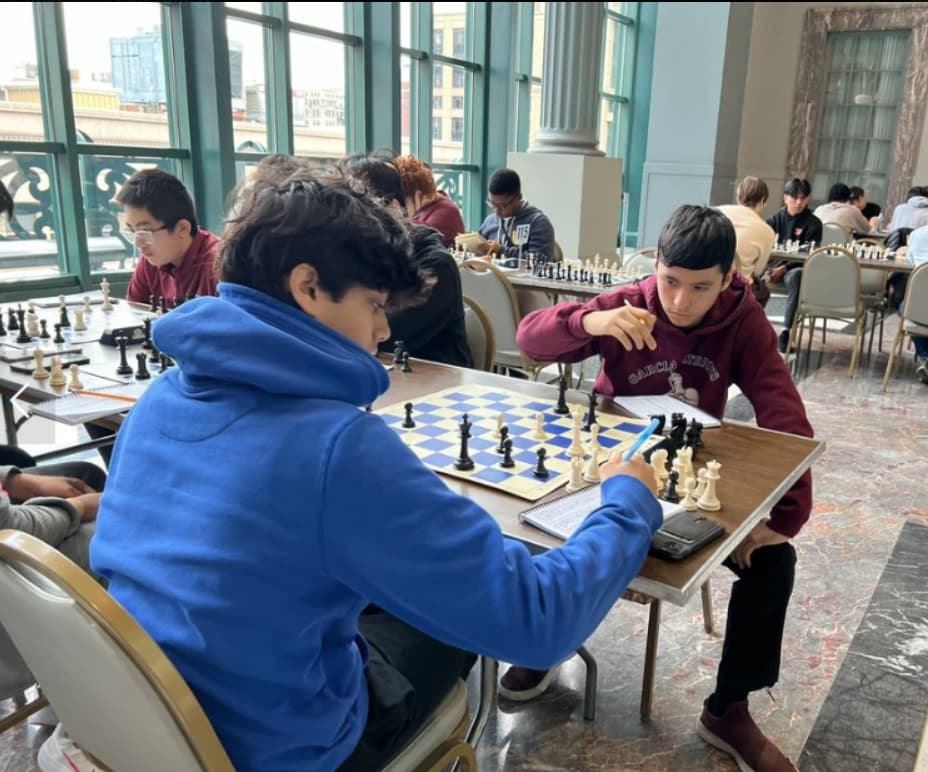 Students competing in a CheckMates chess tournament