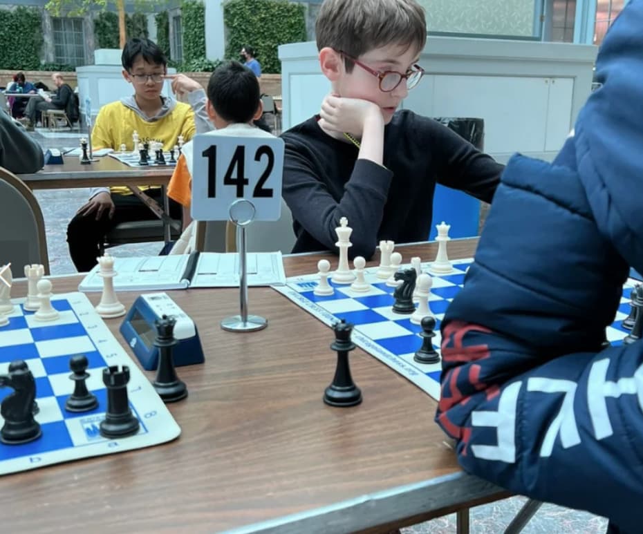 Close-up of students concentrating during a chess match