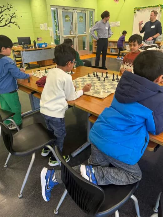 Students engaged in chess learning